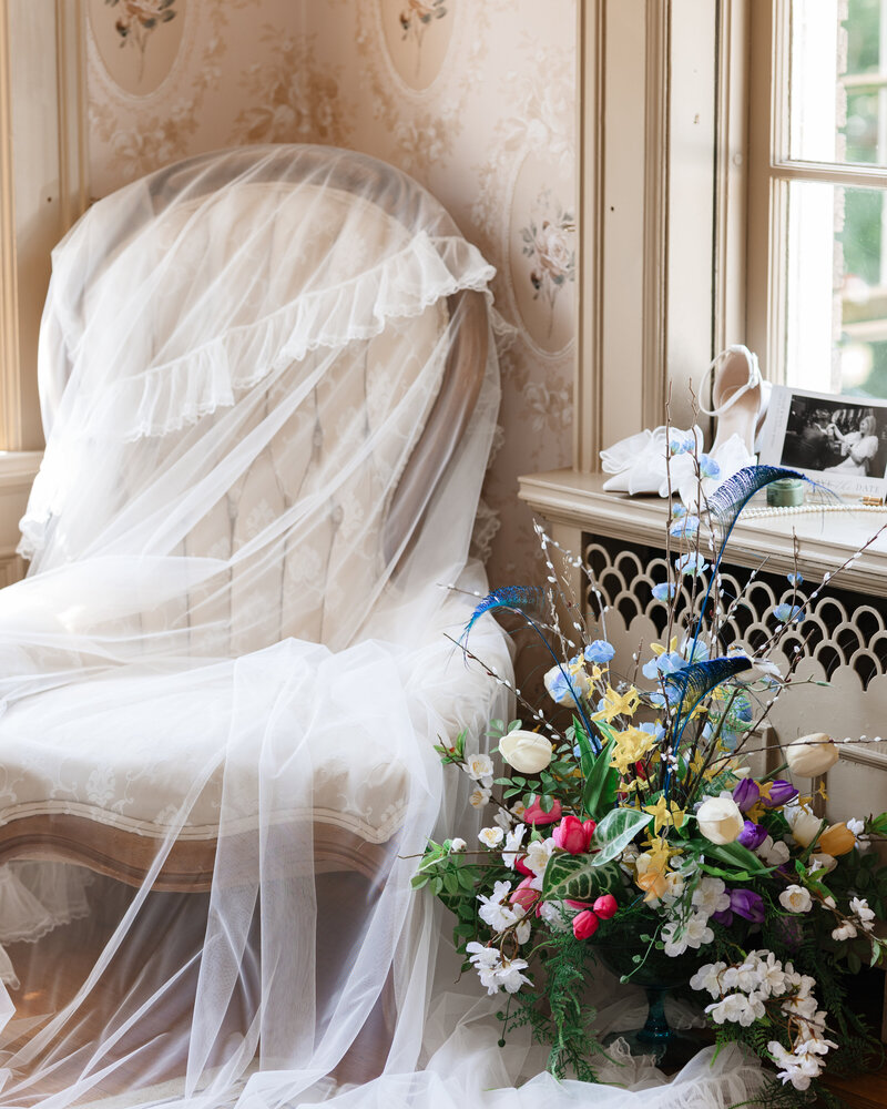 Close-up of bridal accessories including veil, shoes, and flowers at the historic Felt Estate