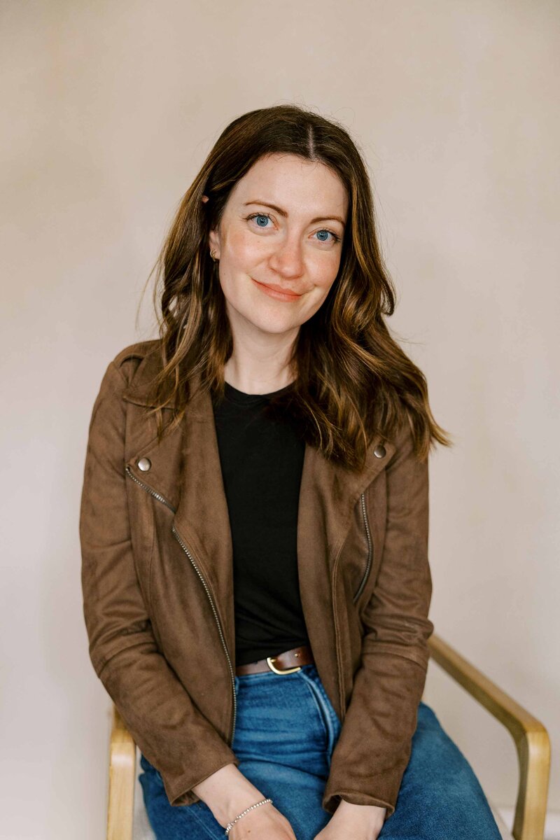 bay area family photographer sitting in a chair and smiling