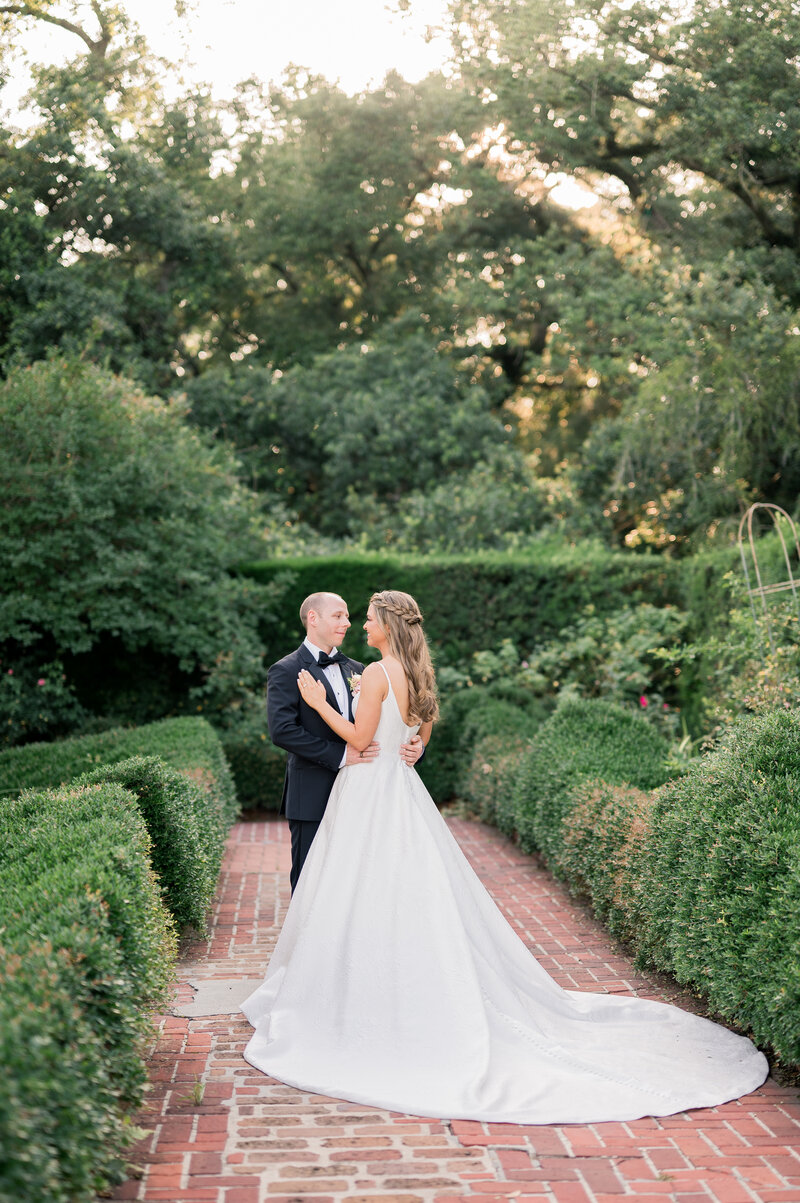 Bride & groom couple's portrait in botanical garden