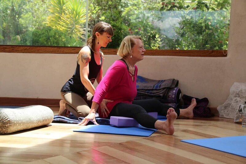 Students of all body types practicing alignment-based yoga at Soma’s inclusive yoga teacher education program