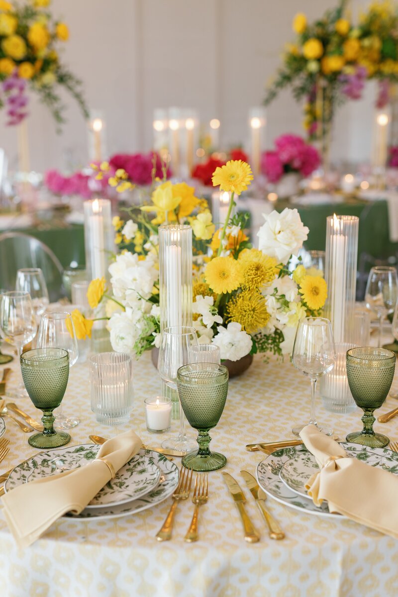Green and yellow tables cape with stunning candles and green floral plates at Wedding Venue Westwind Hills by Lacey Graham Wedding Photographer in Illinois