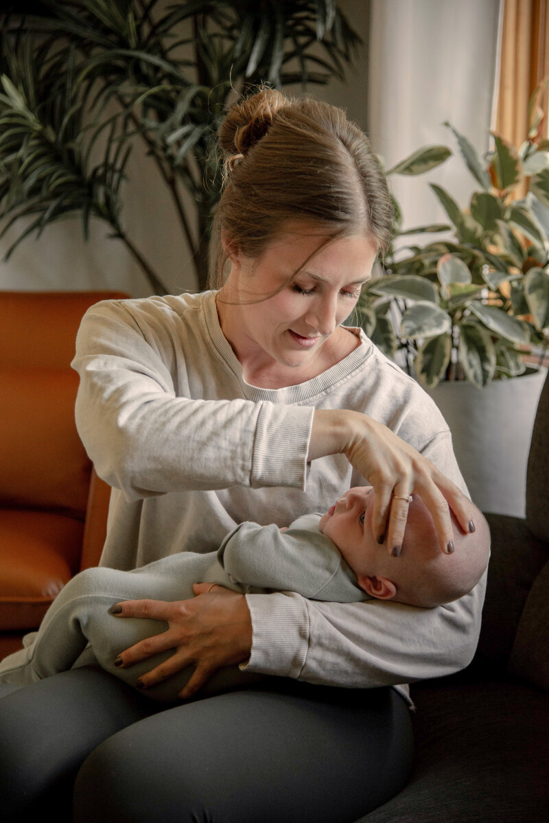 craniosacral therapist with hand on baby's head