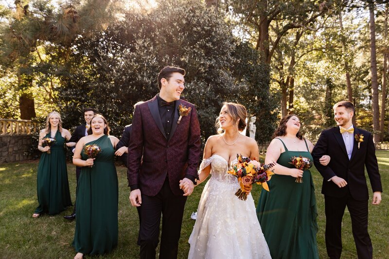 Bride and groom walking with their bridal party