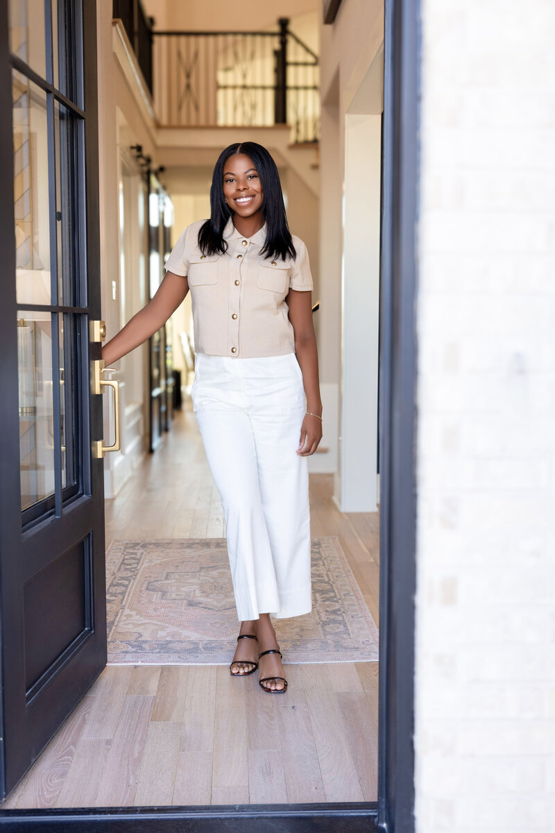Realtor standing in the doorway of a home