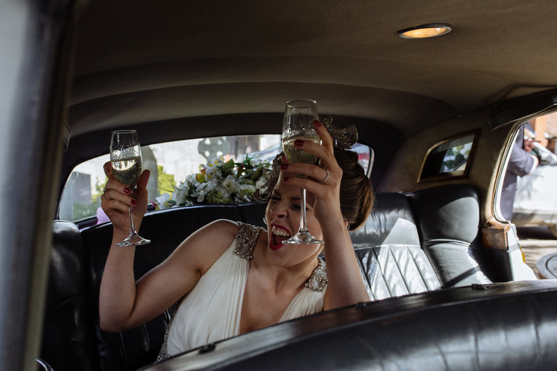 Bride in car at Stoke Park. Modern wedding photographer