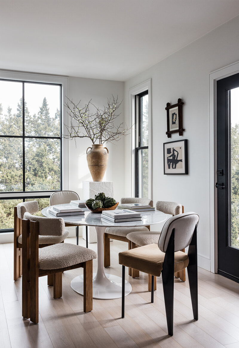 Living room chair with styled shelves in the background