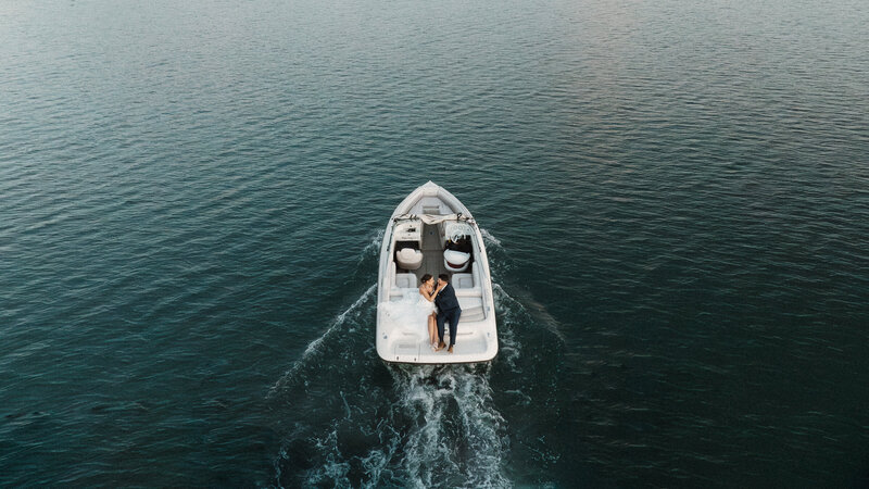 Arial shot of bride and groom on a boat during their wedding at Flat head lake