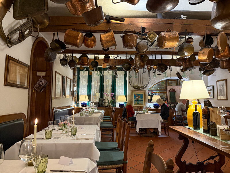 The inside vibe (love all the old pots hung from the ceiling!) at Buca Di Sant'Antonio in Lucca, Italy