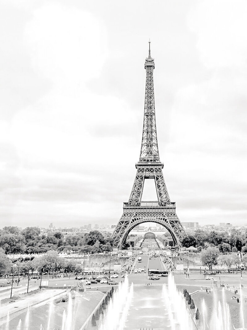 Romantic elopement in Paris near the Eiffel Tower, captured in soft natural light