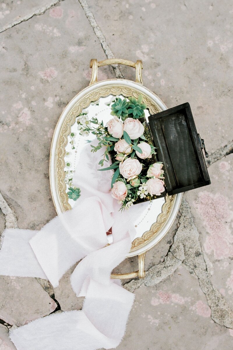 tray-with-roses-lies-tile-floor
