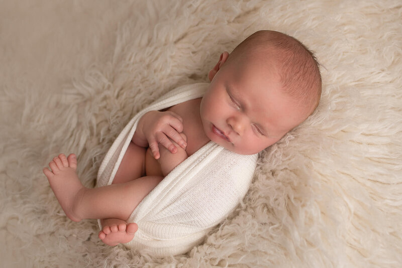 Appleton Newborn Photo baby sleeping on white rug in studio | Glory Be Photo by Tara Bos