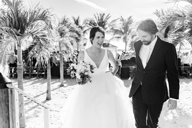 Bride and groom share special moment together after completing their vows at the beach ceremony in St Pete Fl