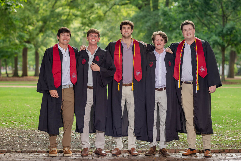 A group of University of South Carolina students, celebrating their graduation at their senior portrait session with their senior photographer, Lyndsey Livingston