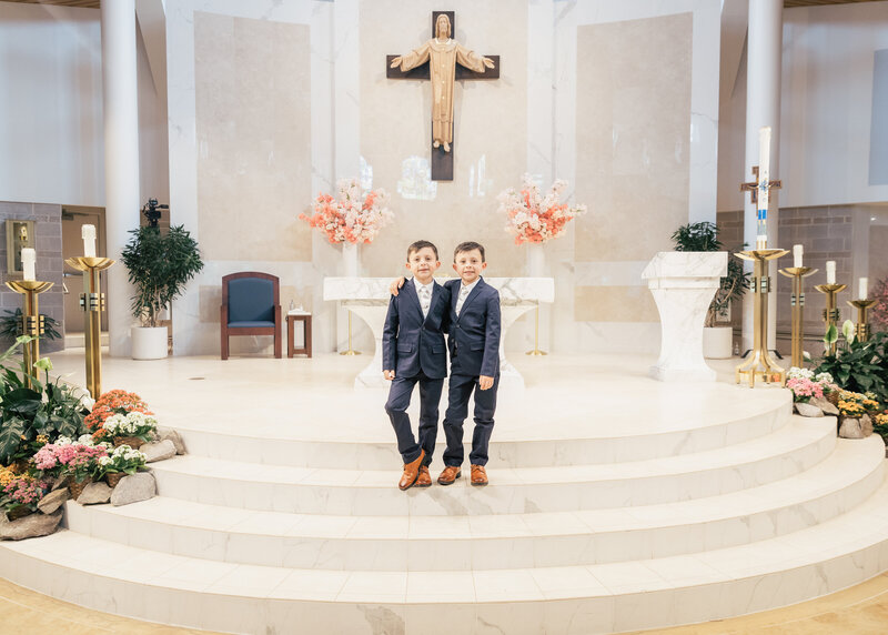 First Communion photo of siblings in a church