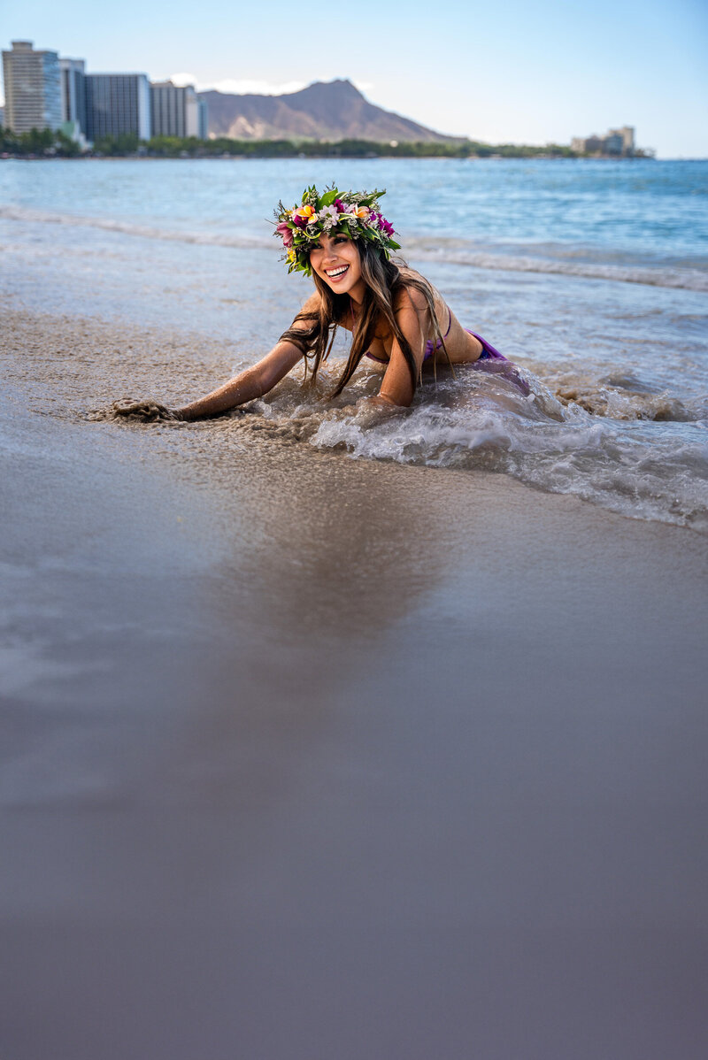 Waikiki portrait of woman wearing flower crown by photographers on the big island Hawaii, Hawaii Adventure Portraits