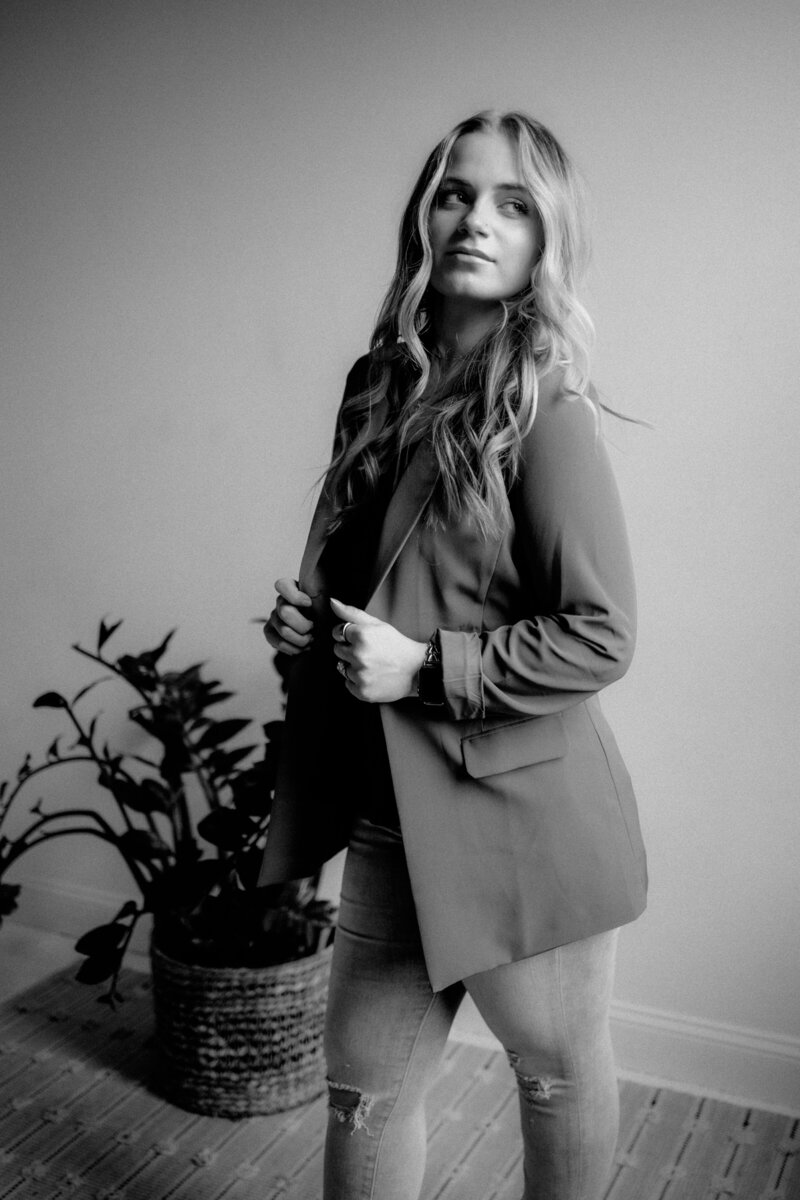 Editorial-style branding photo of Emery, an artistic wedding and portrait photographer in Maine.