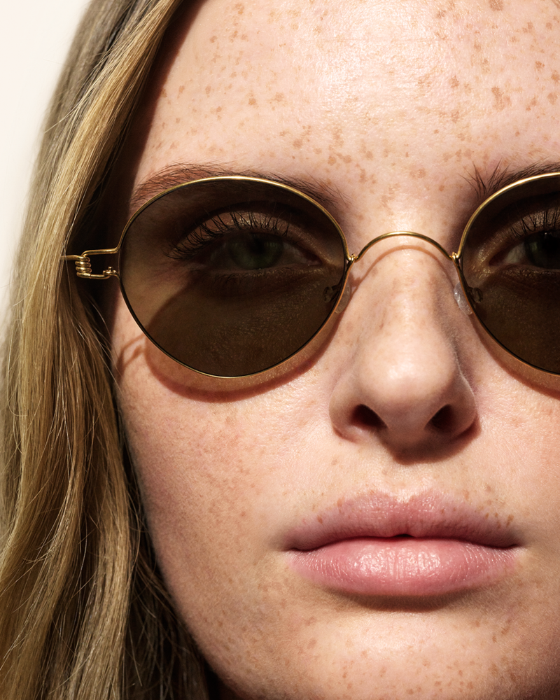 Close up shot of model wearing Lindberg sunglasses on a white backdrop