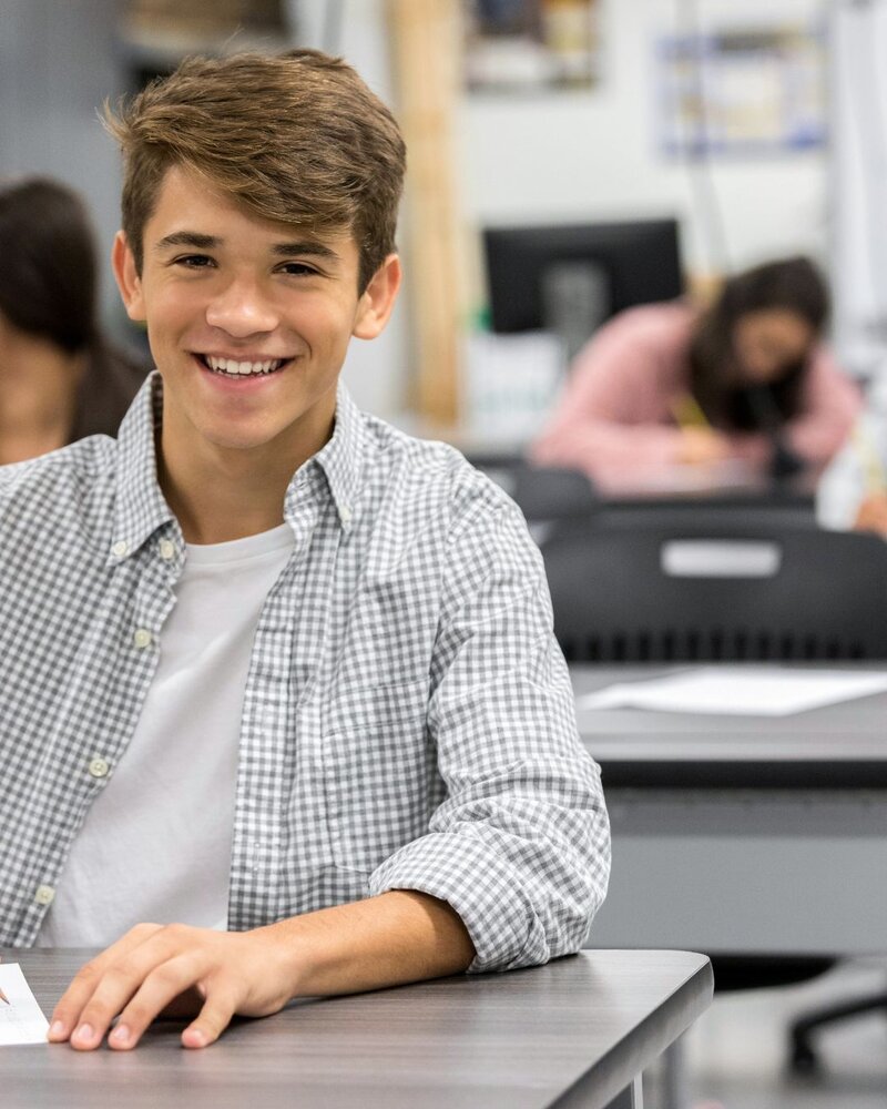 Happy, confident man smiling warmly at the camera.