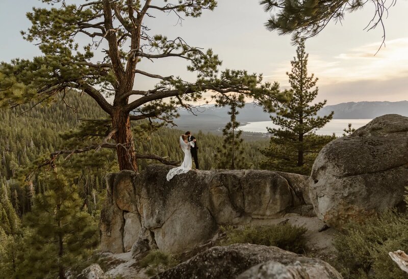 Wedding couple on a cliff captured by Lake Tahoe wedding photographer