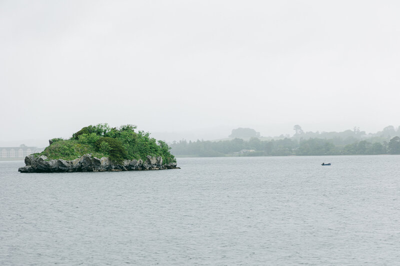 Landscape photo of island in lake during a destination wedding at a castle in Ireland