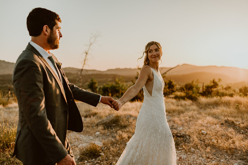 Newlyweds celebrating on boat in Lake Tahoe after elopement ceremony