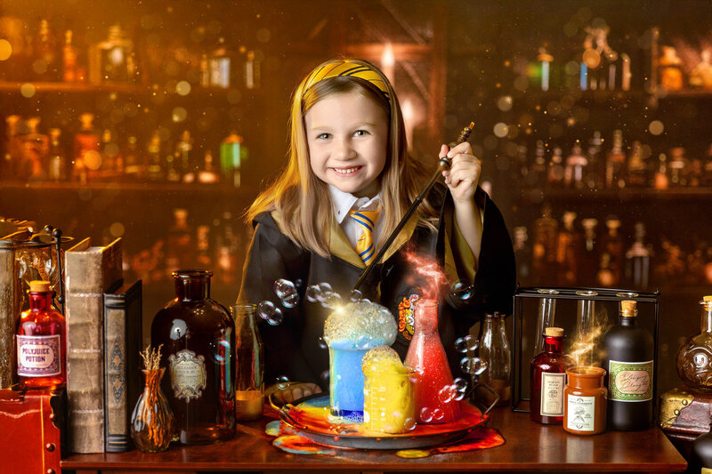 A young boy mixes potions at the Wizarding School Portrait event in Myrtle Beach, SC