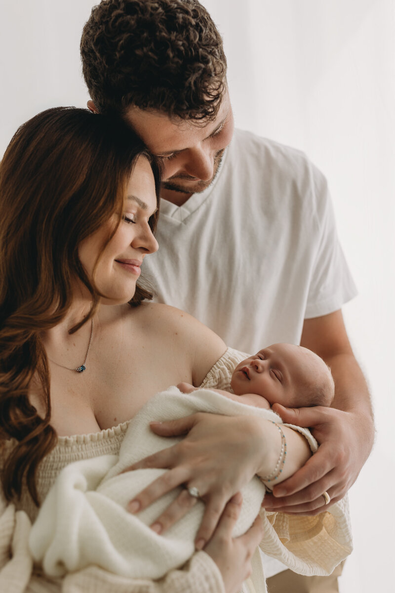 Family of 5 for a newborn shoot. Family with 2 boys and 1 girl.newborn session