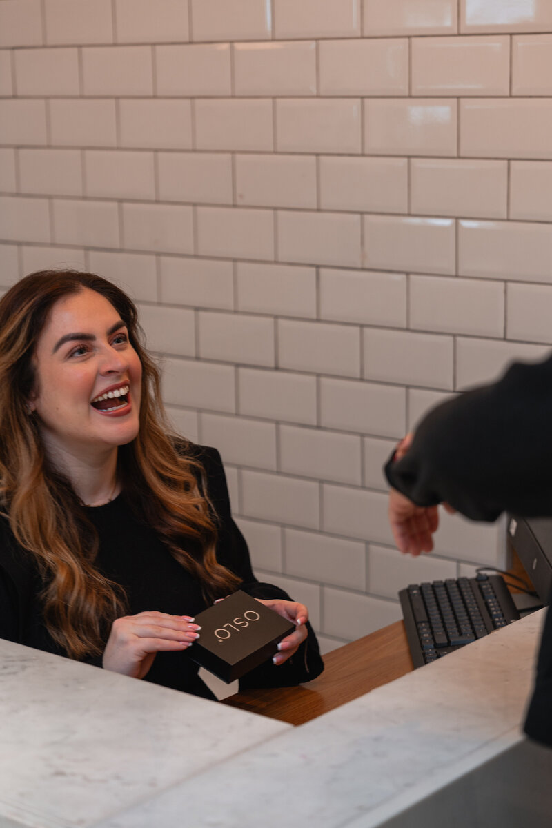 photo of woman holding gift voucher for dublin beauty salon