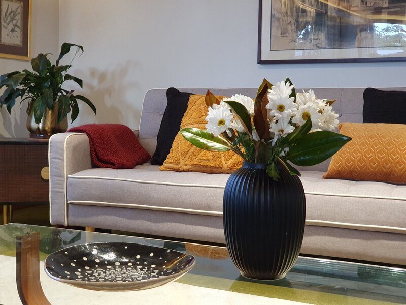 Grey Couch with Yellow Cushion