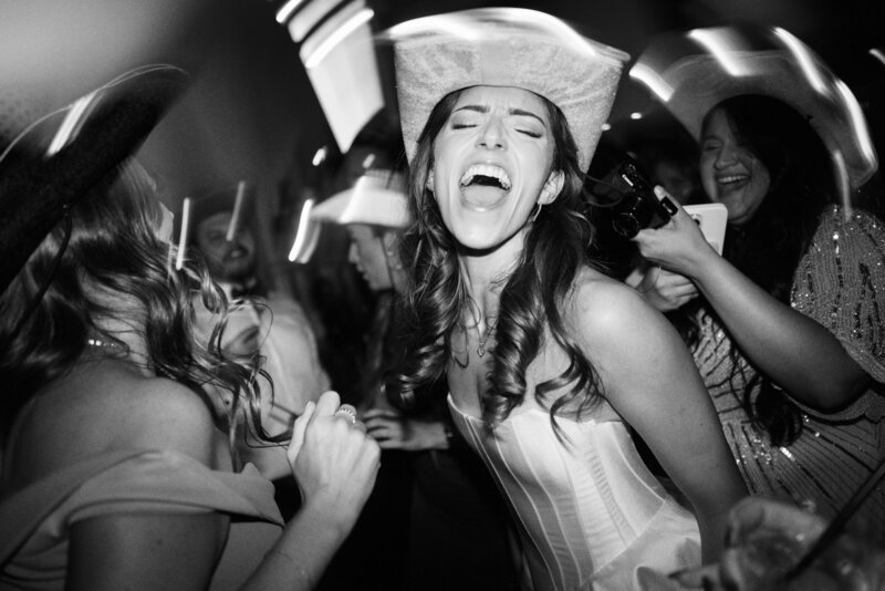 couple standing in front of car on wedding day