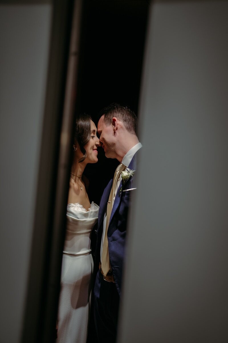 bride and groom sharing an intimate moment