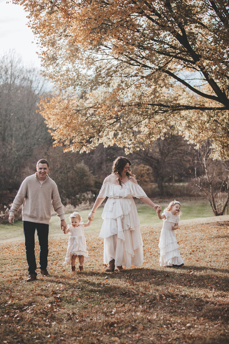 Family Portrait of family walking hand in hand