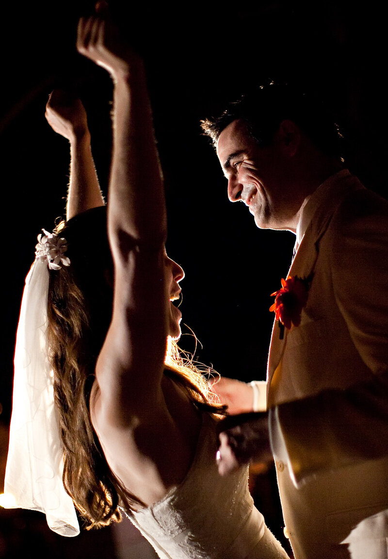 Brian Sellers, a Williamsburg, VA-based wedding videographer, and his bride dancing in love on their wedding day