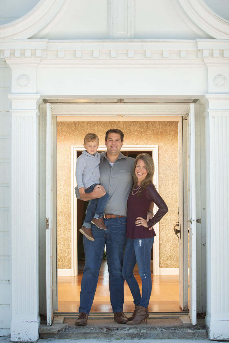 Indoor family portrait of family of three