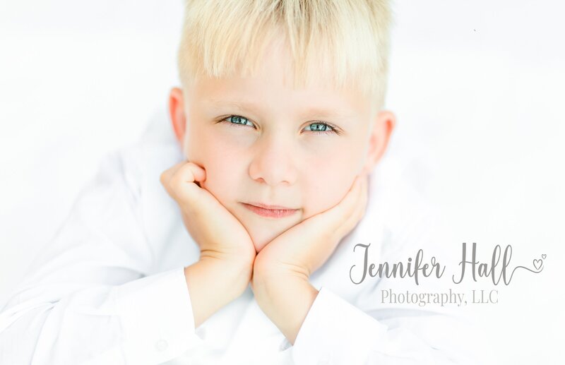 Boy with blond hair with the words “Jennifer Hall Photography, LLC” to show our hearts behind JHP.