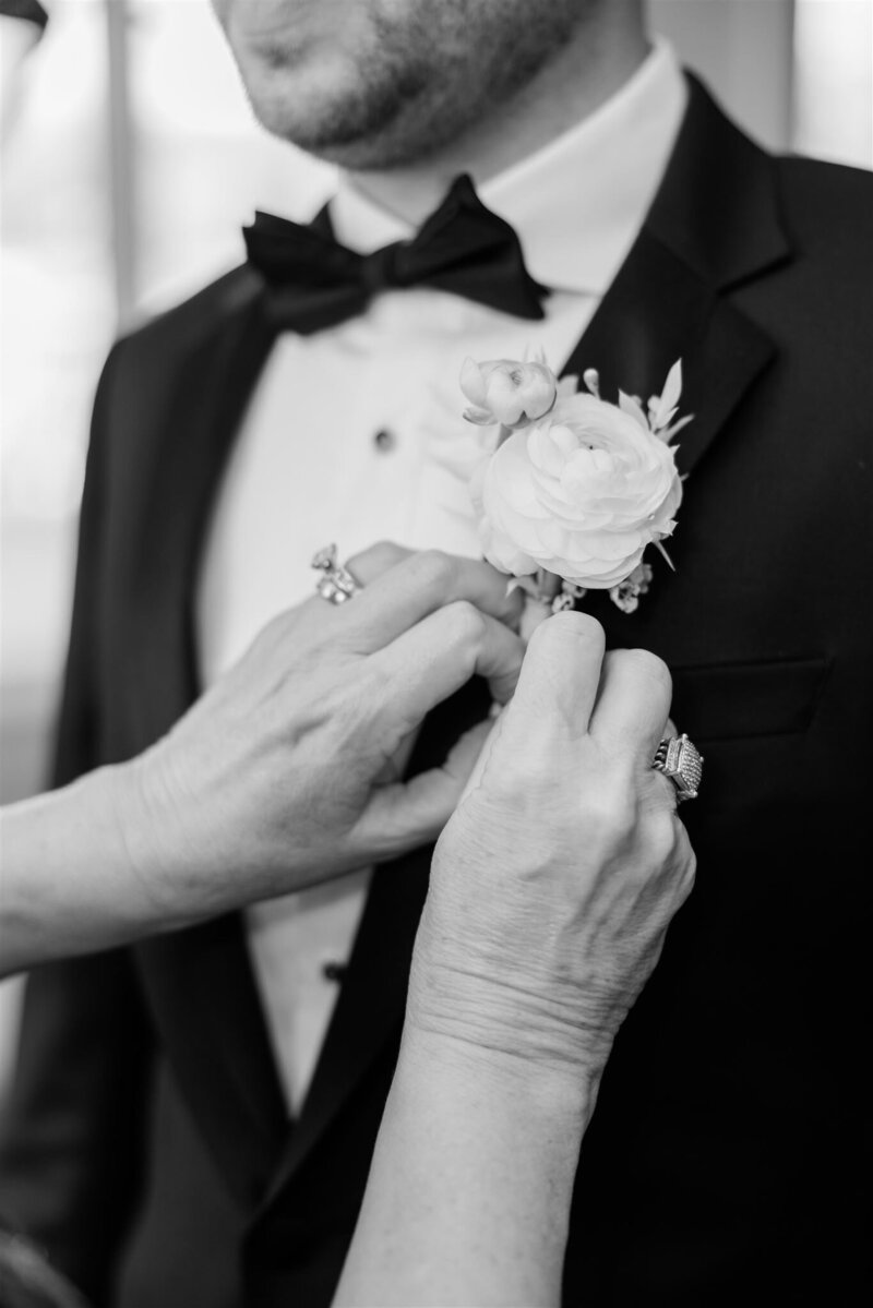 A black and white photo of Groom's boutonniere