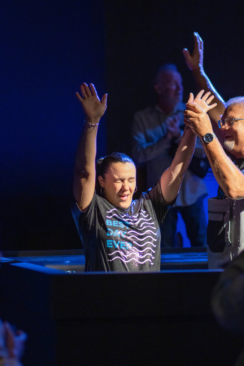 Woman being water baptized at a non-denominational church in Fayetteville, NC. 