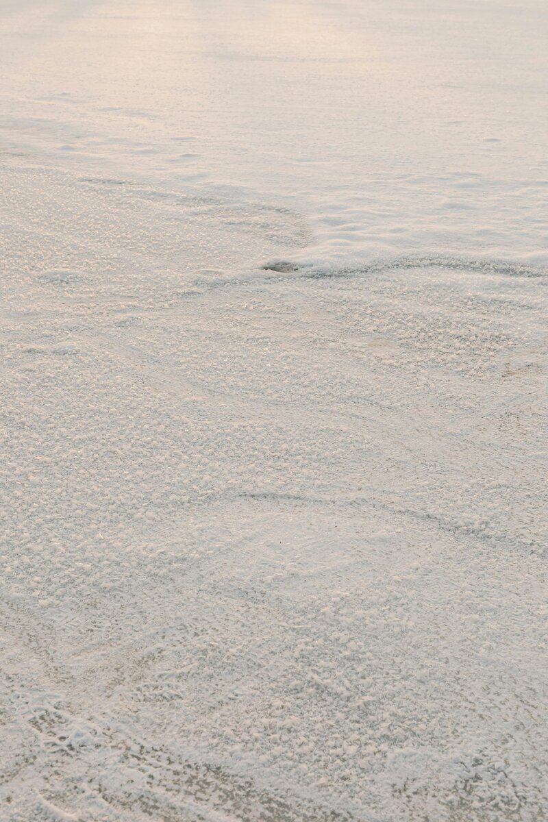 A stunning coastal shot of waves crashing on beach