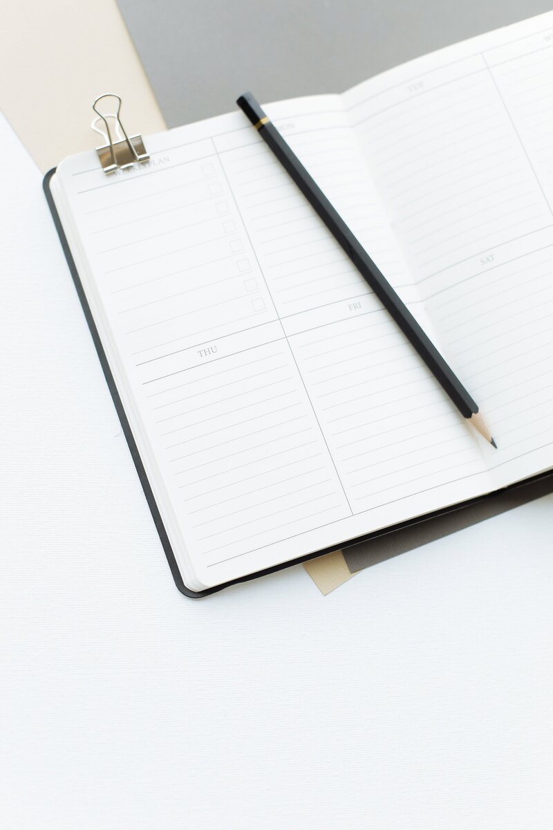planner for business with pencil