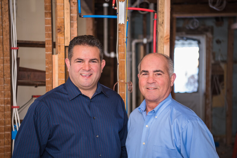 The owner and his partner from Peak Private Lending at a rehab house under construction.