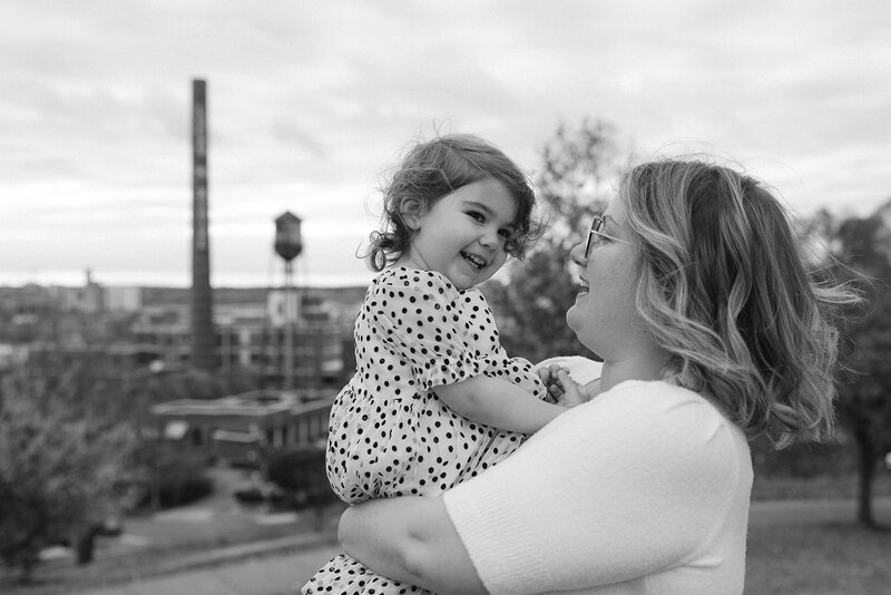 mother and daughter playing at Libby Hill Park during their photoshoot with RVA family photographer, Three Bridge Photography