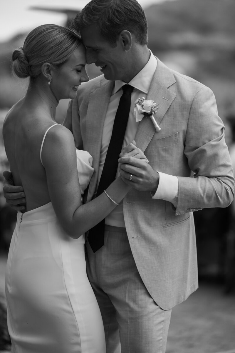 bride and groom embracing during their first dance on their wedding day
