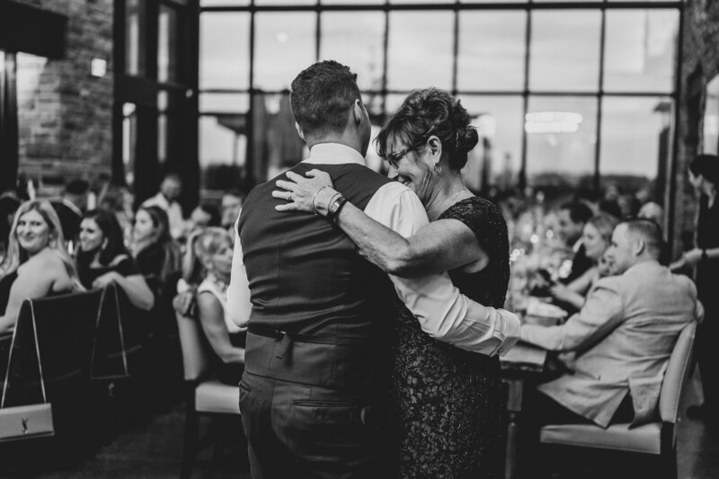 A groom and his mother share a tender moment during their mother son dance in Niagra falls, Ontario.