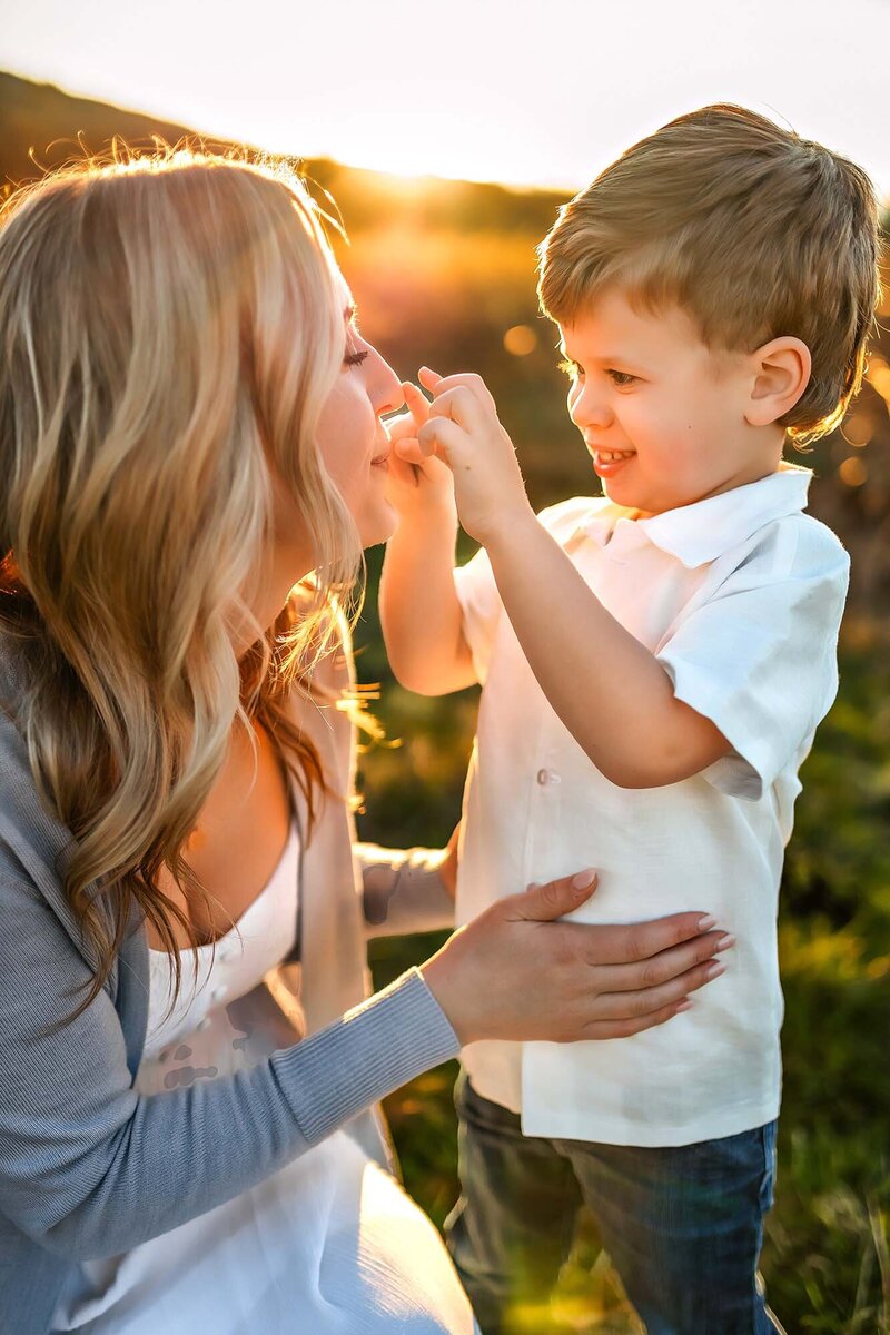 Candid photos captured at sunset with mom and son in the grassy fields of Snoqualmie, WA