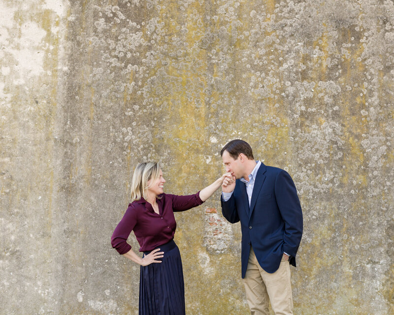 A couple being playful and cute during a romantic autumn or spring mini session in the King of Prussia area.