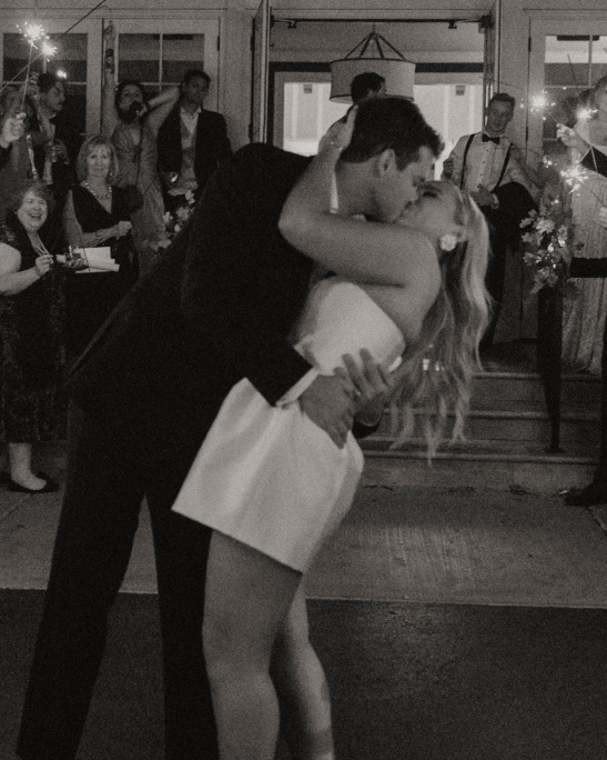 Bride and groom kissing during a first dance 
