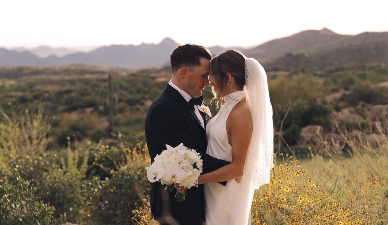 still from california wedding video bride and groom at airport