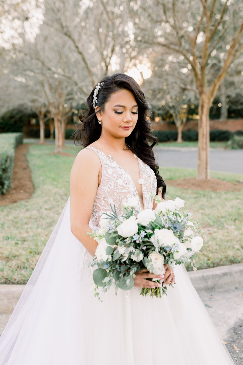 Stunning bride holding her bouquet at the Florida Yacht Club