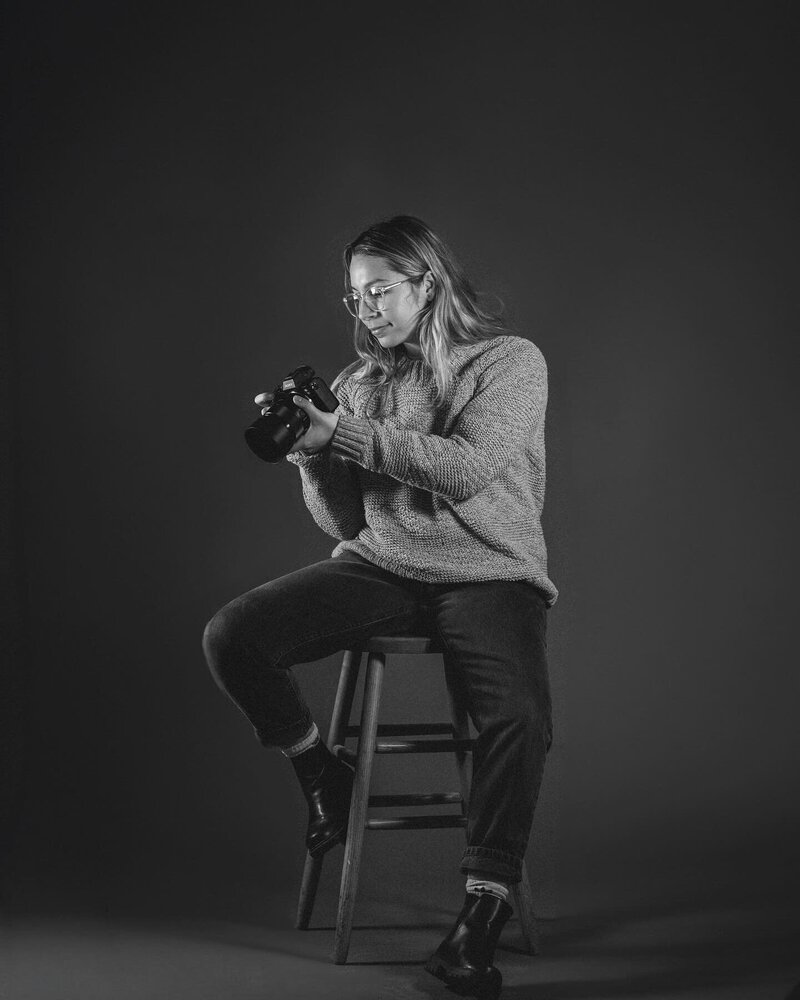 Photographer posing with camera