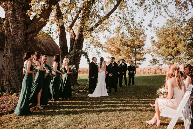 Bride and groom take their vows during outdoor wedding ceremony